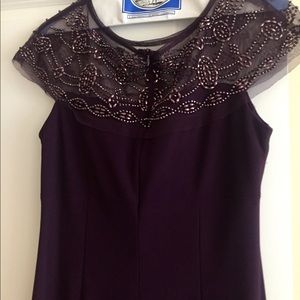 Chiffon evening dress with beaded neckline.